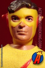 Fully articulated Mego 7-inch Kid Flash action figure with removable fabric outfit.