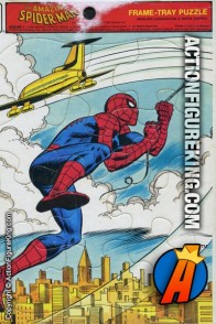 Whitman 12 piece frame-tray puzzle of Spider-Man hitching a ride on the back of an airplane over a cityscape.