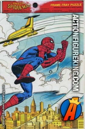 Whitman 12 piece frame-tray puzzle of Spider-Man hitching a ride on the back of an airplane over a cityscape.