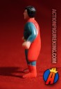 Sideview of this mini SUPERMAN PVC figure.