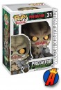 A packaged sample of this Funko Pop! Movies Predator vinyl figure.