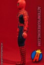 Side view of this Mego 8-inch Spider-Man action figure with authentic fabric outfit.