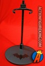 DC Direct Batman doll stand with varnished logo.