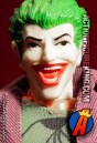 Fully articulated Mego 8-inch Joker action figure with removable fabric outfit.