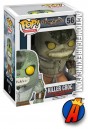 A [ackaged sample of this Funko Pop! Heroes Arkham Asylum Killer Croc figure.