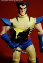 Seen here holding his mask is Wolverine as a Famous Covers 8 Inch action figure from Toybiz.