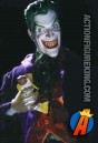 A very demented looking 1:6th scale DC Direct Joker action figure with authentic fabric outfit.
